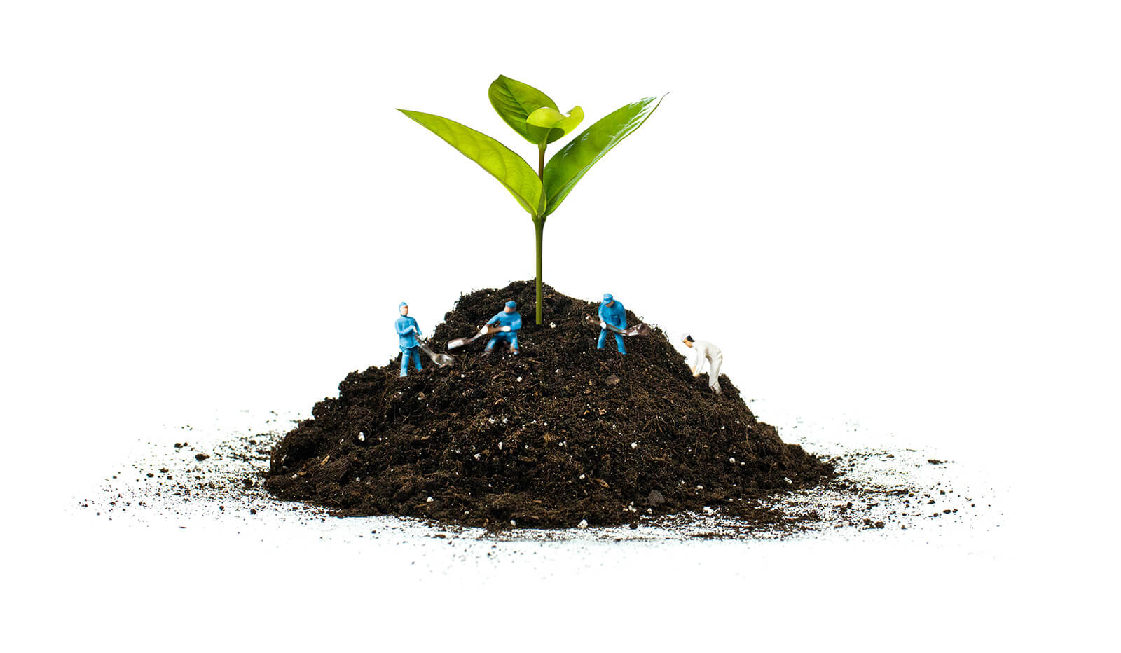 Figurines digging in a pile of dirt